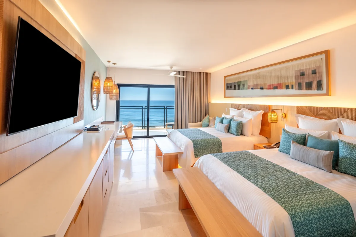 Deluxe Junior Suite Ocean View with two double beds and balcony at Dreams Estrella del Mar Mazatlan Golf & Spa Resort.
