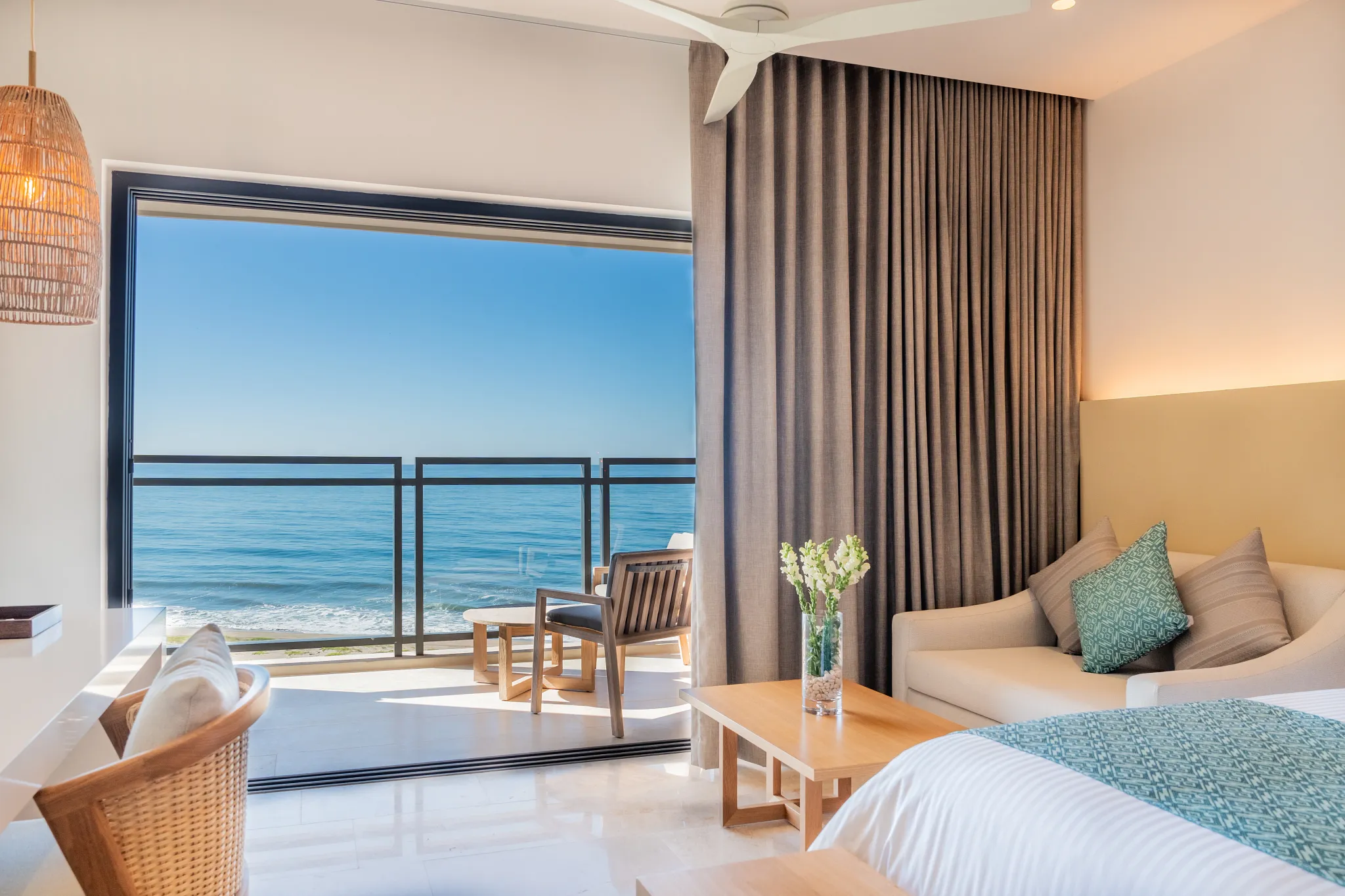 Deluxe Junior Suite Ocean View with king bed, seating area, and balcony overlooking the Pacific at Dreams Estrella del Mar Mazatlan.