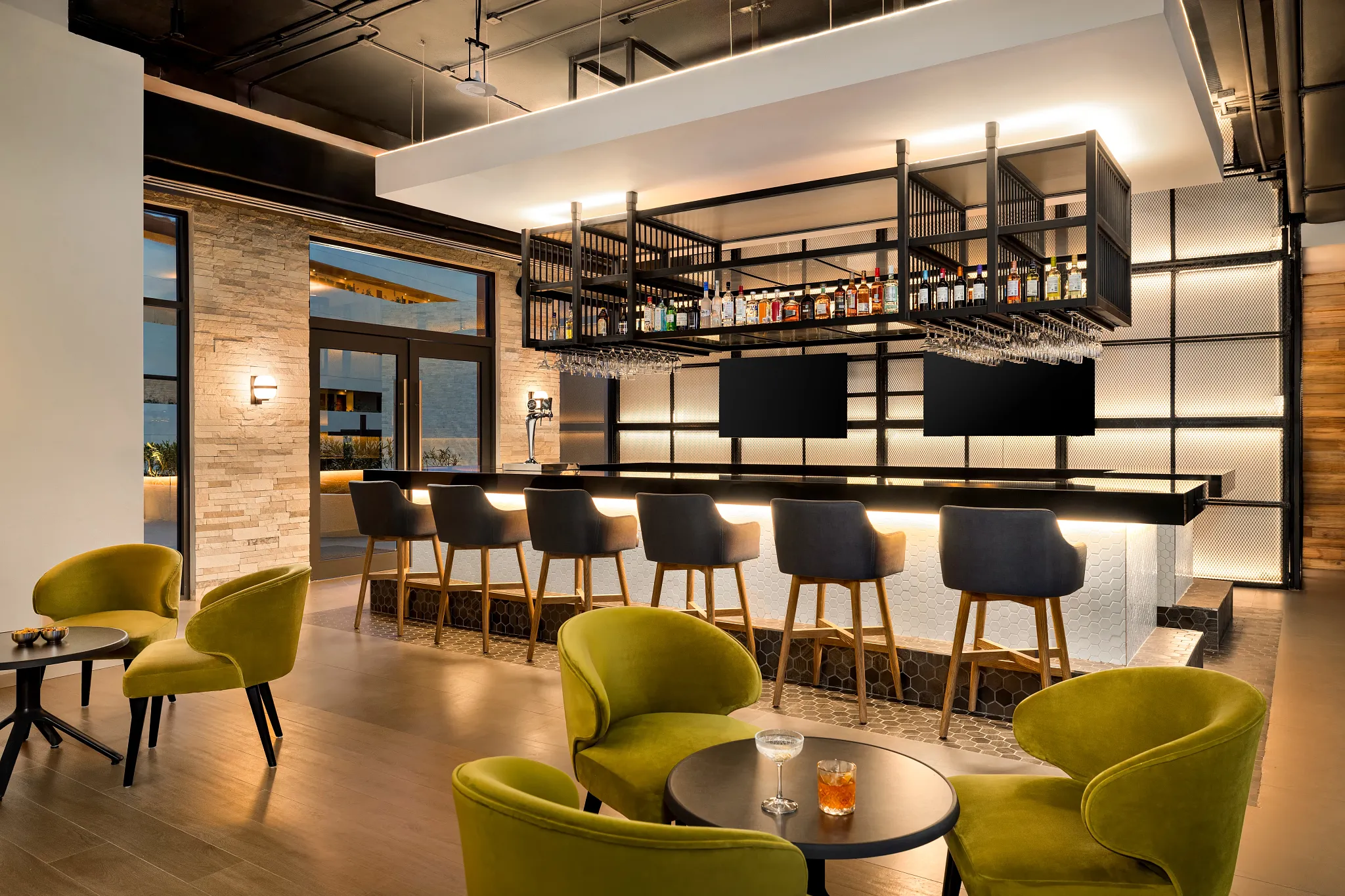 Desires sports bar and music lounge at Dreams Estrella del Mar Mazatlan featuring a modern bar, lounge seating, and stylish nightlife atmosphere.