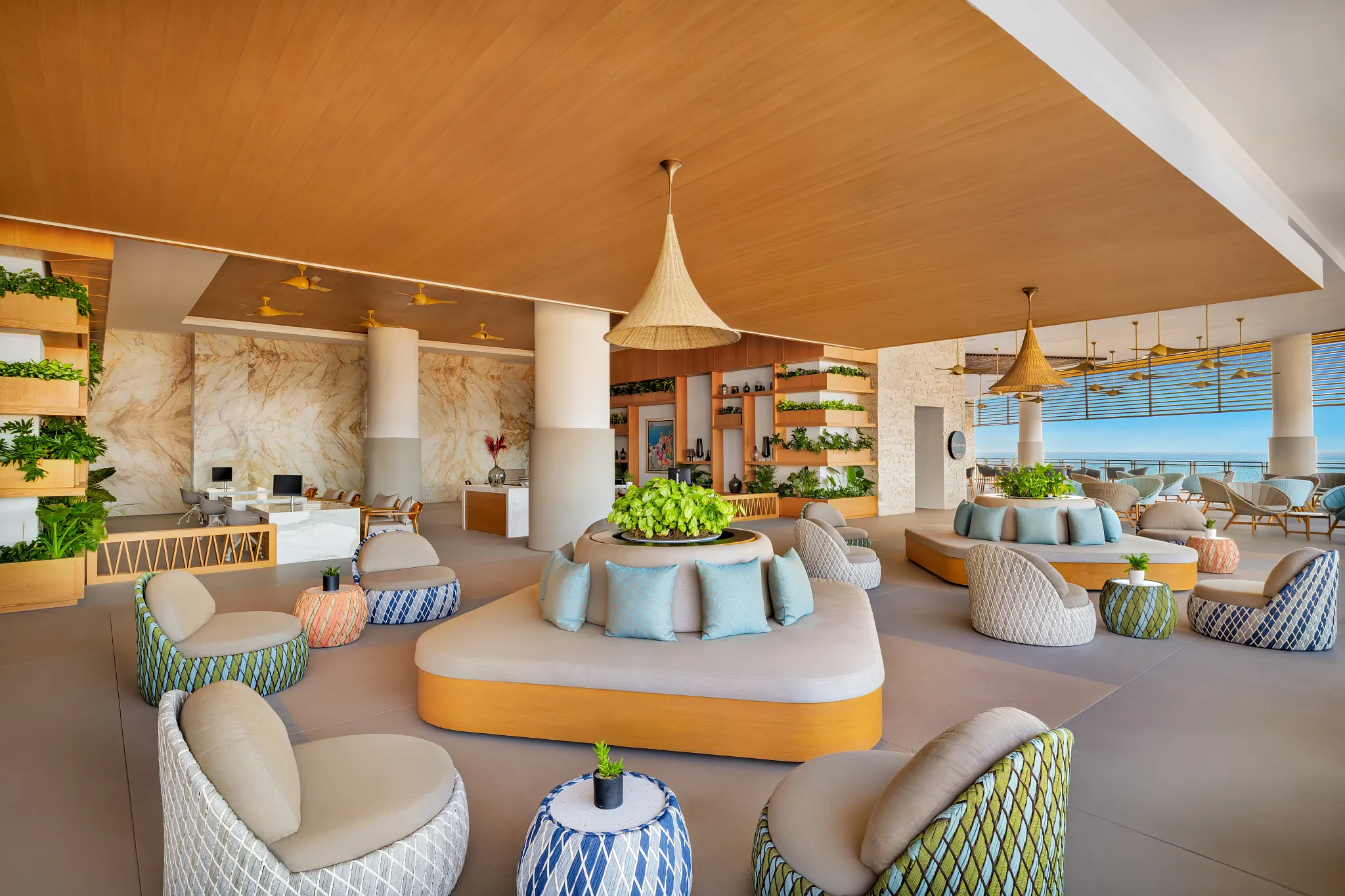 Elegant open-air lobby with modern seating and ocean views at Dreams Estrella del Mar Mazatlan Golf & Spa Resort.