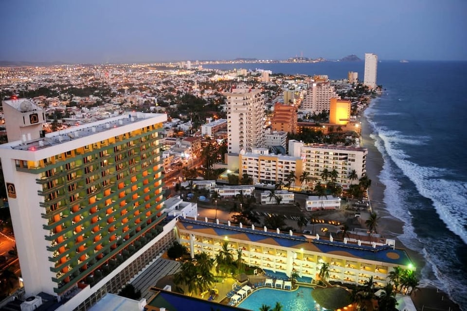 El Cid Castilla Beach Hotel Mazatlan beachfront resort with pools, palm trees, and golden zone location.