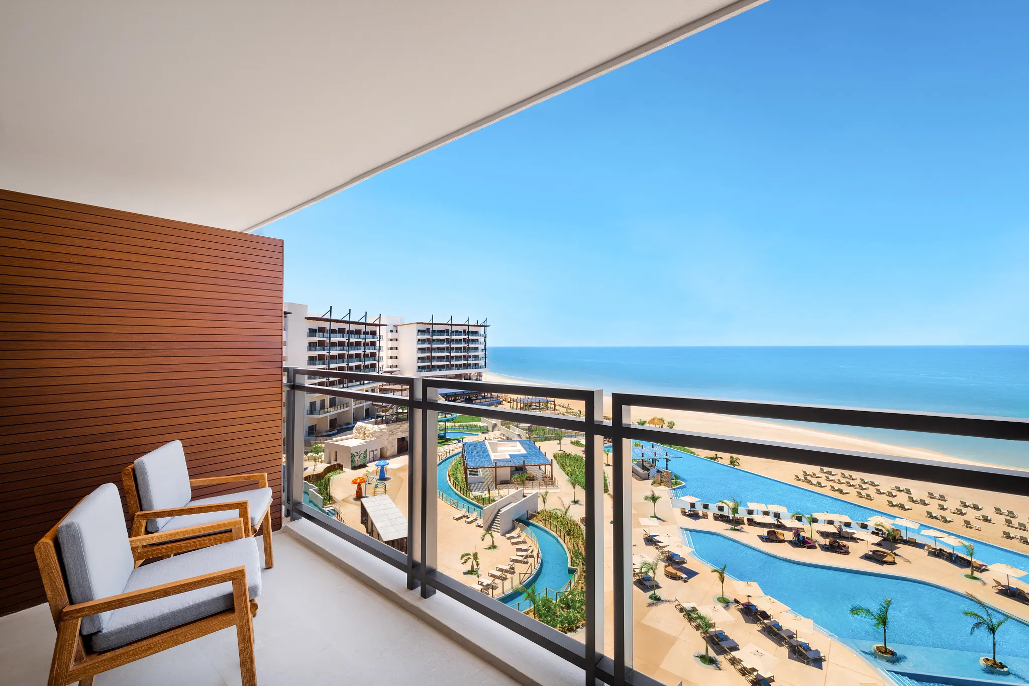 Private balcony with ocean and pool views from Junior Suite Ocean View at Dreams Estrella del Mar Mazatlan.