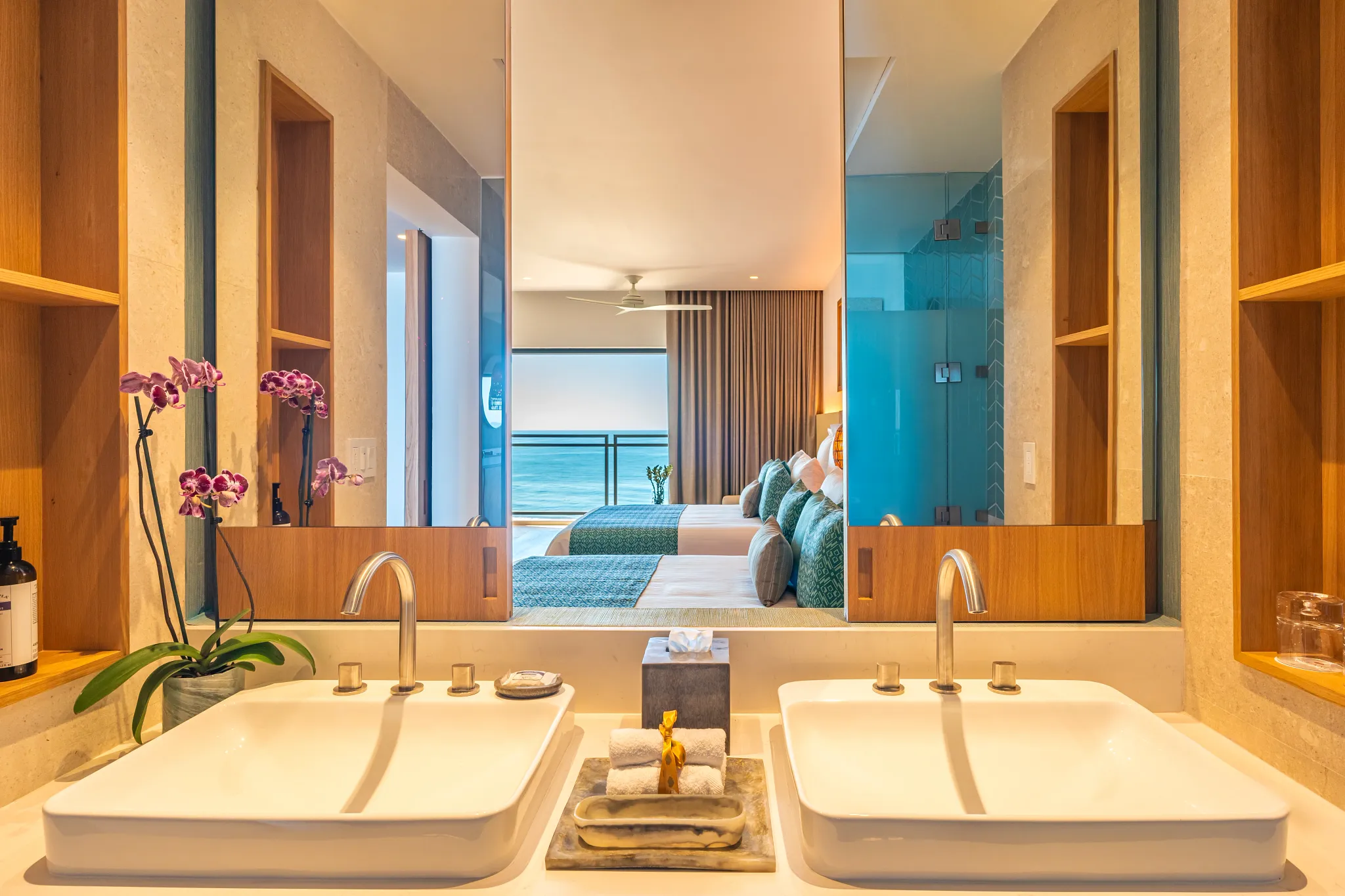 Junior Suite Ocean View bathroom with dual sinks and large mirror at Dreams Estrella del Mar Mazatlan Resort.