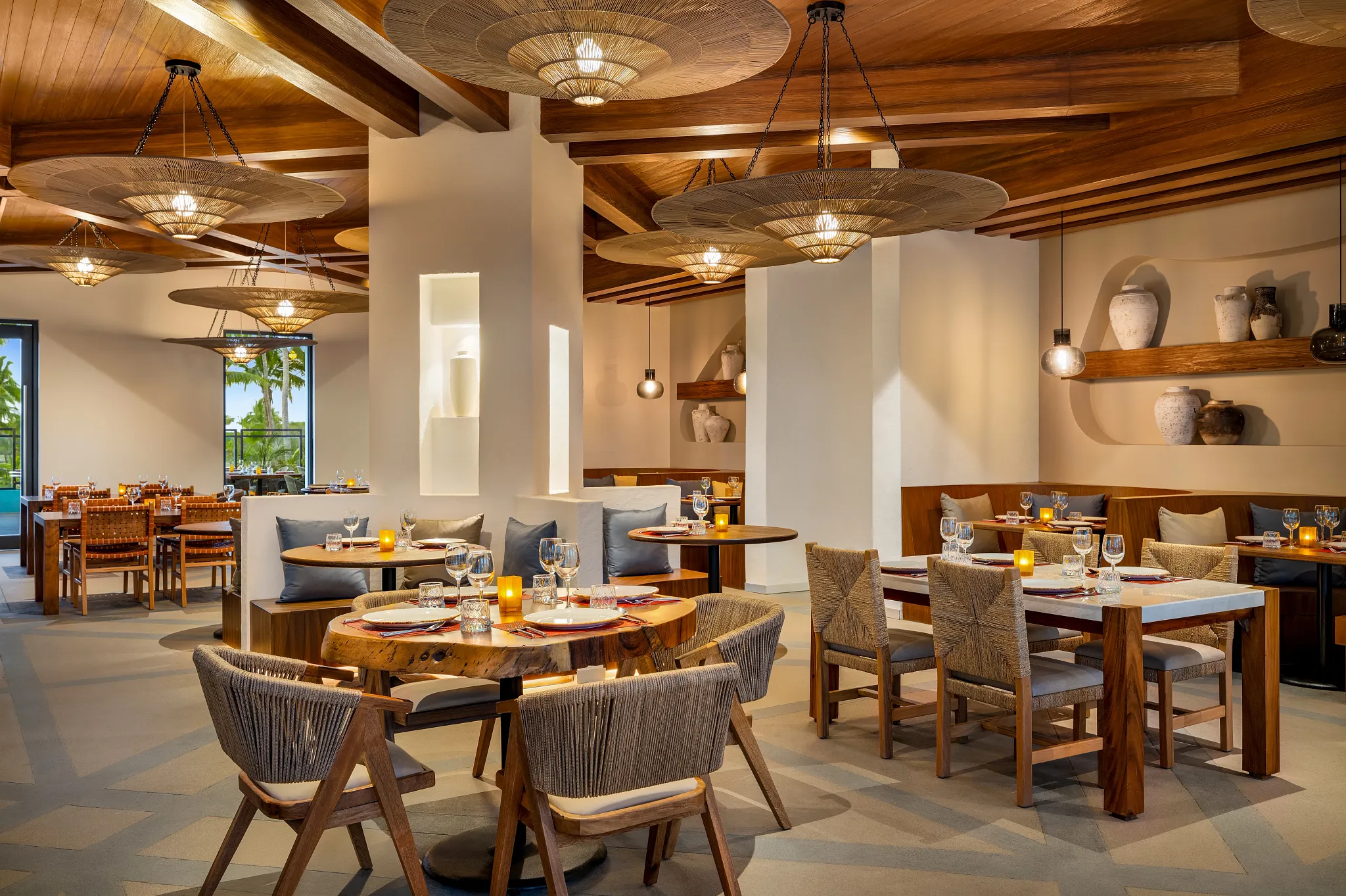 Meraki Mediterranean-Asian fusion restaurant at Dreams Estrella del Mar Mazatlan featuring elegant dining space with warm wood décor and modern lighting.