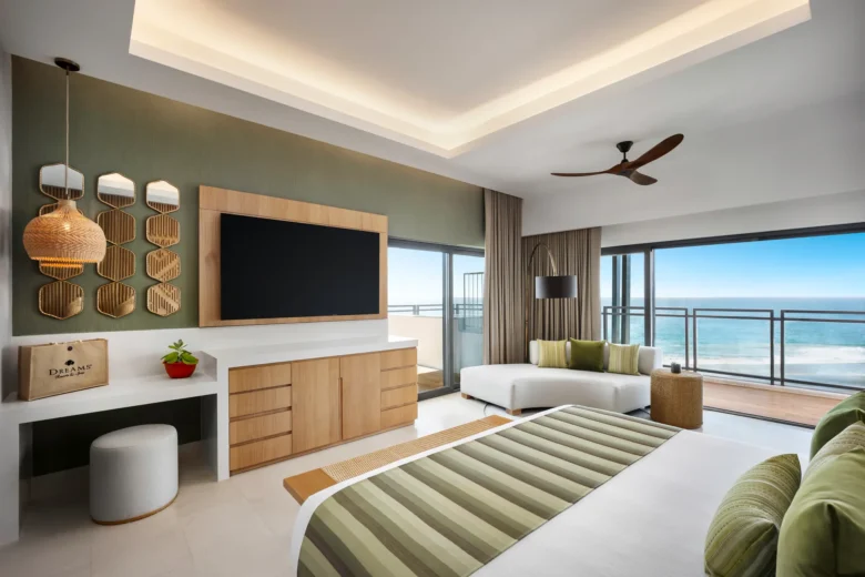 One-Bedroom Presidential Suite Ocean Front bedroom with ocean-view balcony at Dreams Estrella del Mar Mazatlan.