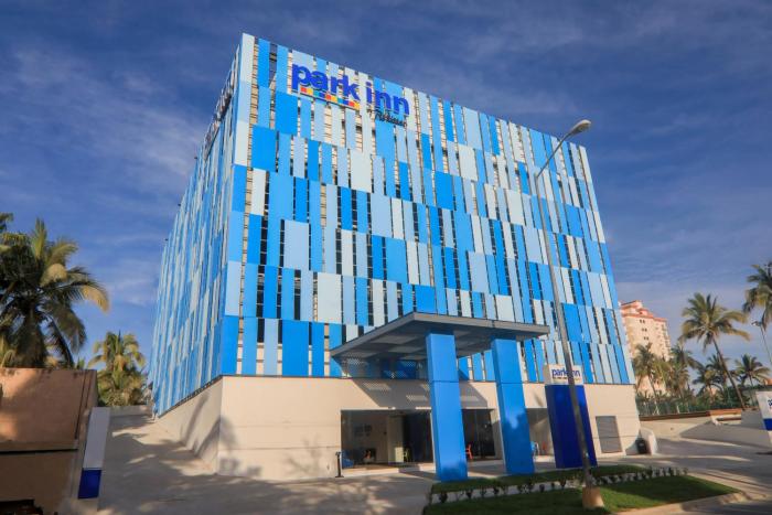 Park Inn by Radisson Mazatlan hotel exterior with pool area located in the Golden Zone near beaches and restaurants.