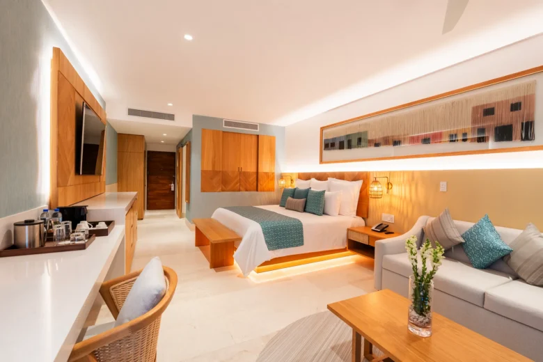 Preferred Club Junior Suite Swim Out with king bed and seating area at Dreams Estrella del Mar Mazatlan Golf & Spa Resort.