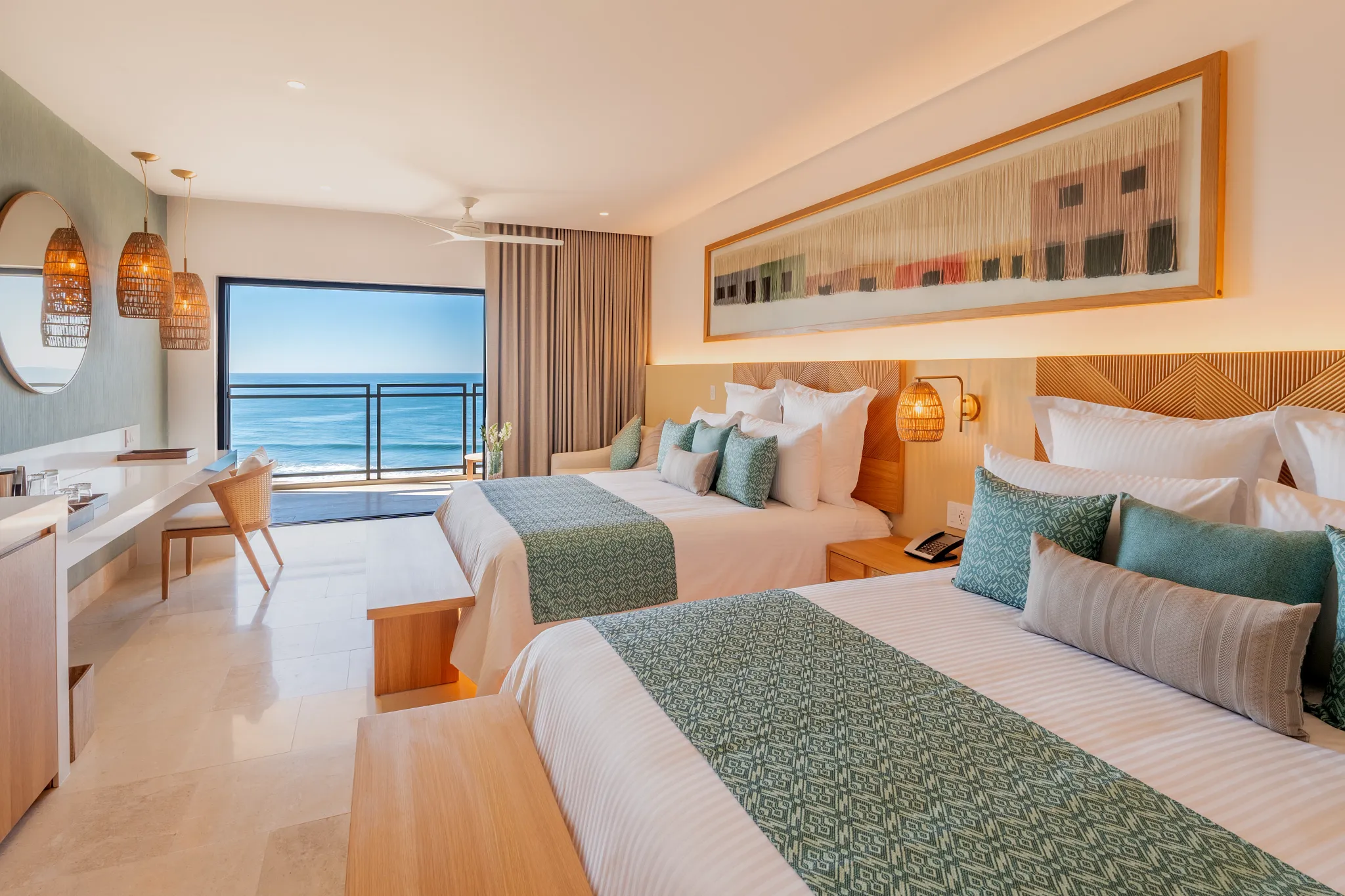 Preferred Club Premium Ocean Front suite with double beds and ocean-view balcony at Dreams Estrella del Mar Mazatlan.