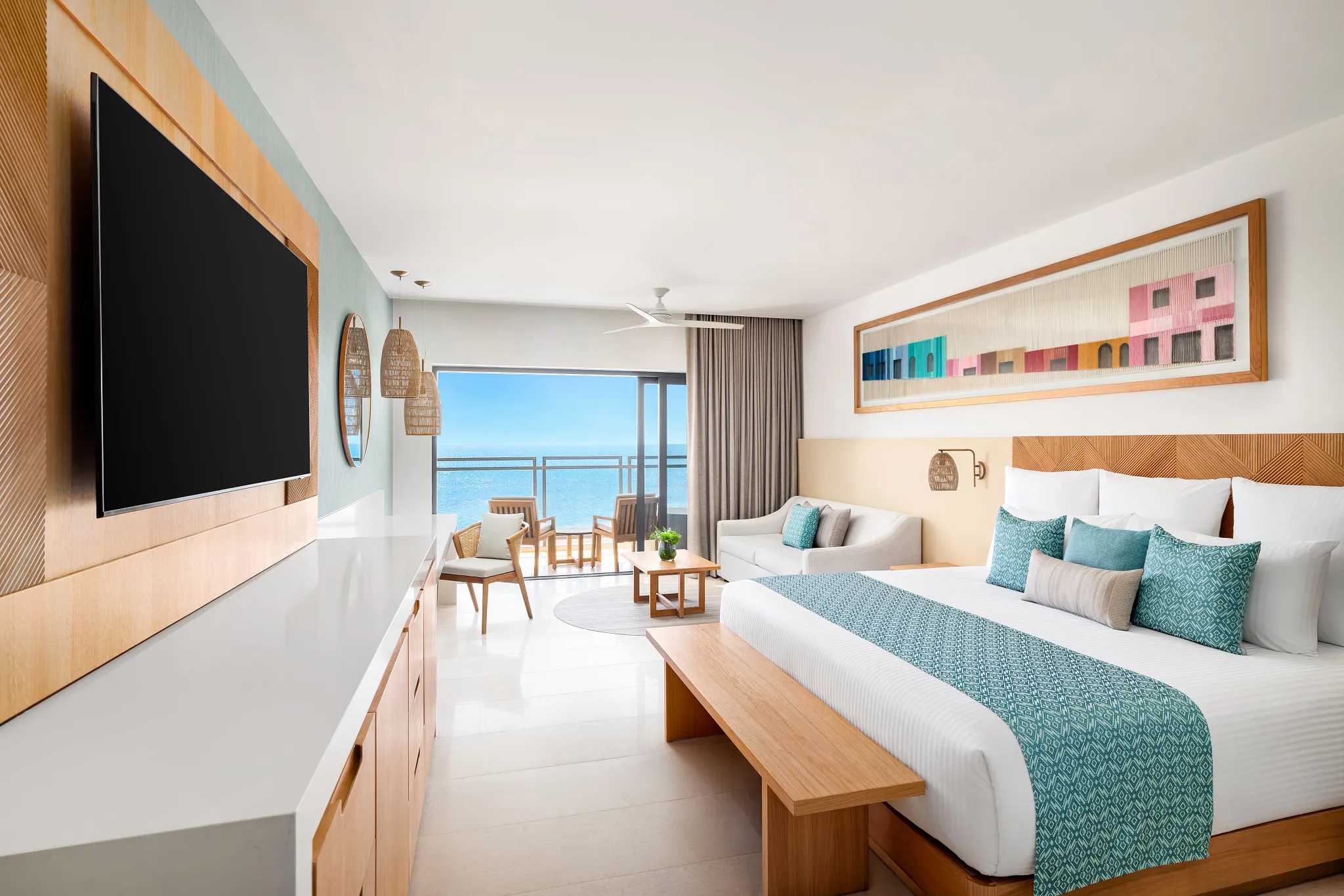 Preferred Club Premium Ocean Front suite with king bed and ocean-view balcony at Dreams Estrella del Mar Mazatlan.