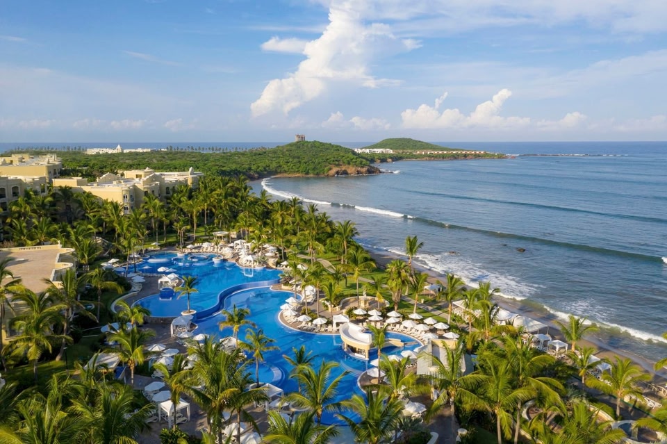 Pueblo Bonito Emerald Bay Resort and Spa Mazatlan with cliffside pools, ocean views, and Mediterranean-inspired architecture.